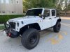 Pre-Owned 2013 Jeep Wrangler Unlimited Sport