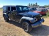 Pre-Owned 2015 Jeep Wrangler Unlimited Willys Wheeler Edition
